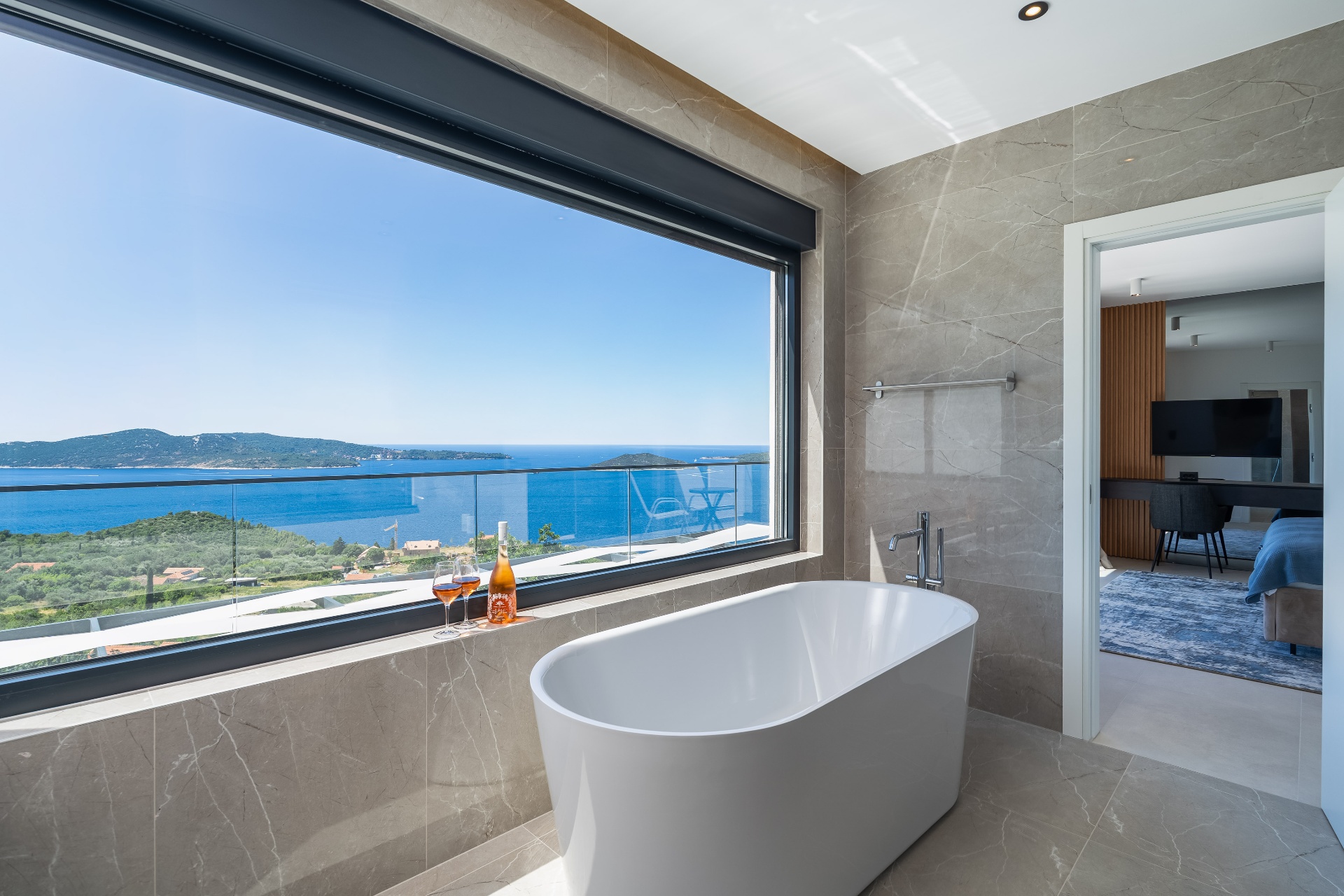Marble bathroom with panoramic sea view