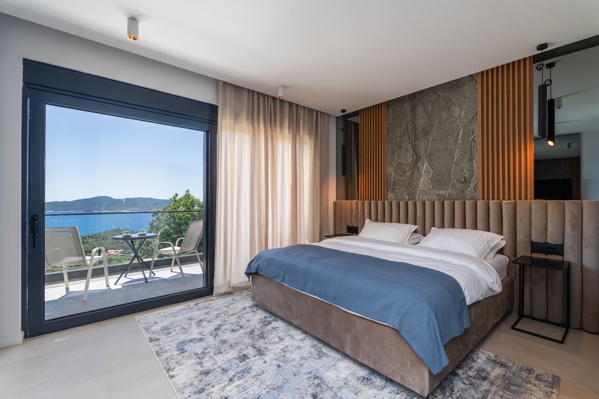 Modern bedroom with full glass sea view